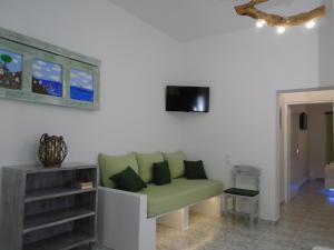 A television and/or entertainment centre at Leros Eleonas Apartments