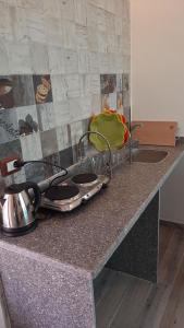 a kitchen counter with a sink and two sinks at Diamond Dahab House in Dahab