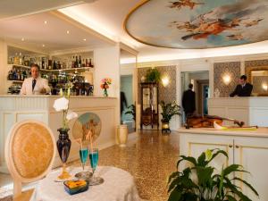 a dining room with a table and a bar at Hotel Doge in Vicenza