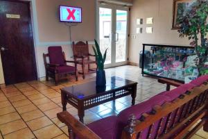 En tv och/eller ett underhållningssystem på Hotel Posada Santa Fe