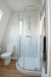 a bathroom with a shower and a toilet at Finest Retreats - Nelly's Nook in Matlock