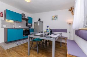 Kuchyň nebo kuchyňský kout v ubytování Apartment Diva