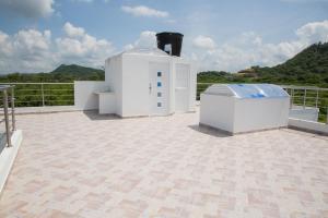 a white building on top of a roof at VILLA MANDALAY in Santa Veronica