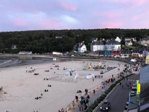 a group of people on a beach with a crowd at L'Imprenable vue mer in Crozon