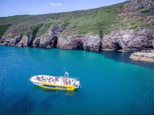 a group of people on a boat in the water at L'Imprenable vue mer in Crozon