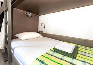 Postel nebo postele na pokoji v ubytování BOHOSTEL