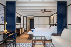 Llit o llits en una habitació de Ocean Coral Spring Resort - All Inclusive