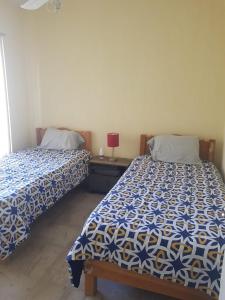 Una cama o camas en una habitación de Depa Playa Halcon