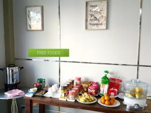 a table with food on top of it at Sabuy Chiangmai in Chiang Mai