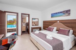 Voodi või voodid majutusasutuse Kolymbia Village toas