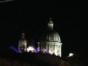 a building with lights on it at night at Duca di Uzeda Bed and Breakfast in Catania