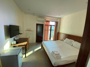 Postel nebo postele na pokoji v ubytování Jitra Resort + 26 fotografií