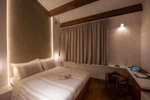 Posteľ alebo postele v izbe v ubytovaní Locanda Remare