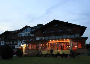 a large building with a lot of windows at Airporthotel Salzburg - Hotel am Salzburg Airport in Salzburg