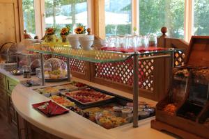 a buffet line with many different types of food at Airporthotel Salzburg - Hotel am Salzburg Airport in Salzburg