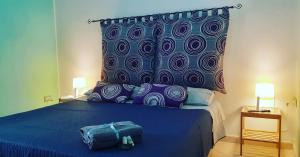 Postel nebo postele na pokoji v ubytování O'Paisi Casa Vacanze