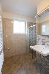 Kúpeľňa v ubytovaní Apartmány AURA