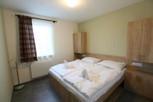 Posteľ alebo postele v izbe v ubytovaní Apartmány AURA