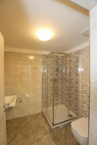 Kúpeľňa v ubytovaní Apartmány AURA + 14 fotografií