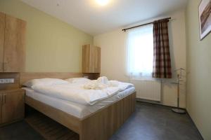 Posteľ alebo postele v izbe v ubytovaní Apartmány AURA