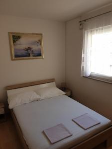 Postel nebo postele na pokoji v ubytování Apartman Branka