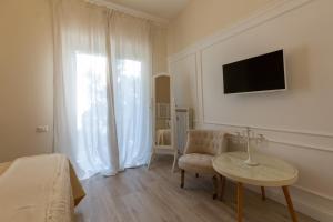 TV a/nebo společenská místnost v ubytování Twins House Sorrento