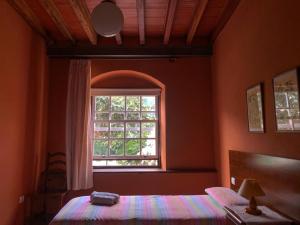 Postel nebo postele na pokoji v ubytování Casa Yanes Casas Rurales