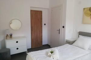 Postel nebo postele na pokoji v ubytování Dimitrios Loft Apartment