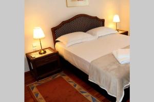 Postel nebo postele na pokoji v ubytování Cosy 3bedroom Apartment in the center of Volos