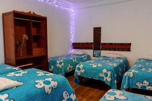 Postel nebo postele na pokoji v ubytování Posada Azul Cusco