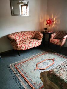 a living room with a couch and a table at Heidi's Home in Garmisch-Partenkirchen