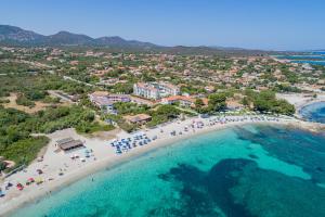 an aerial view of a beach with people and umbrellas at Hotel Mare Blue in Olbia