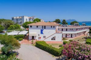 an aerial view of a large white building at Hotel Mare Blue in Olbia