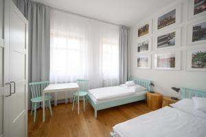 Posteľ alebo postele v izbe v ubytovaní Světoběžník Bed & Wine