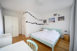 Posteľ alebo postele v izbe v ubytovaní Světoběžník Bed & Wine