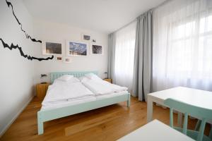 Posteľ alebo postele v izbe v ubytovaní Světoběžník Bed & Wine