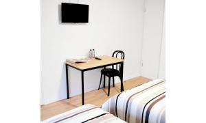 TV a/nebo společenská místnost v ubytování B&B Le Clos du Lac