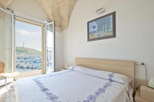 Ένα ή περισσότερα κρεβάτια σε δωμάτιο στο Marechiaro