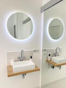 a bathroom with two sinks and a mirror at monaco, CHAMBRE LUXE, à 250M casino in Beausoleil