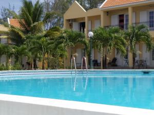 Bazén v ubytování Palmar Beach Villa nebo v jeho okolí