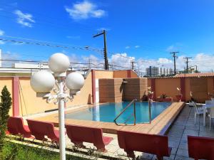 a swimming pool on the roof of a building at Hotel Pousada Villa Calhau in São Luís