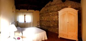Ліжко або ліжка в номері Agriturismo Borgo Serafino