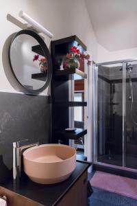 a bathroom with a large tub and a mirror at B&B MI Casa Tu Casa in Pavia +67 photos