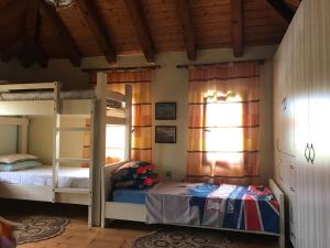 Postel nebo postele na pokoji v ubytování Loy Loy House