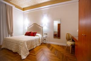 Postel nebo postele na pokoji v ubytování Boutique Hotel Puccini