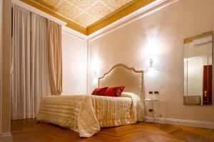 Postel nebo postele na pokoji v ubytování Boutique Hotel Puccini