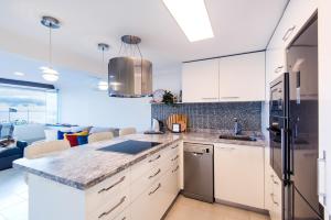 A kitchen or kitchenette at Beach Front Apartment-1st Line