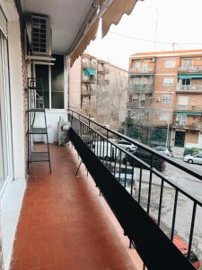 a balcony with a ladder and a view of a street at New Apartament close to IFEMA-AEROPUERTO in Madrid