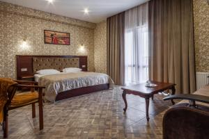 En eller flere senger på et rom på Karap Hotel