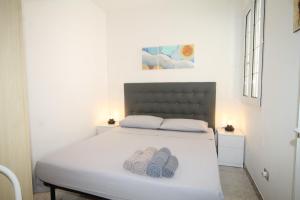 A bed or beds in a room at Villetta Campurè